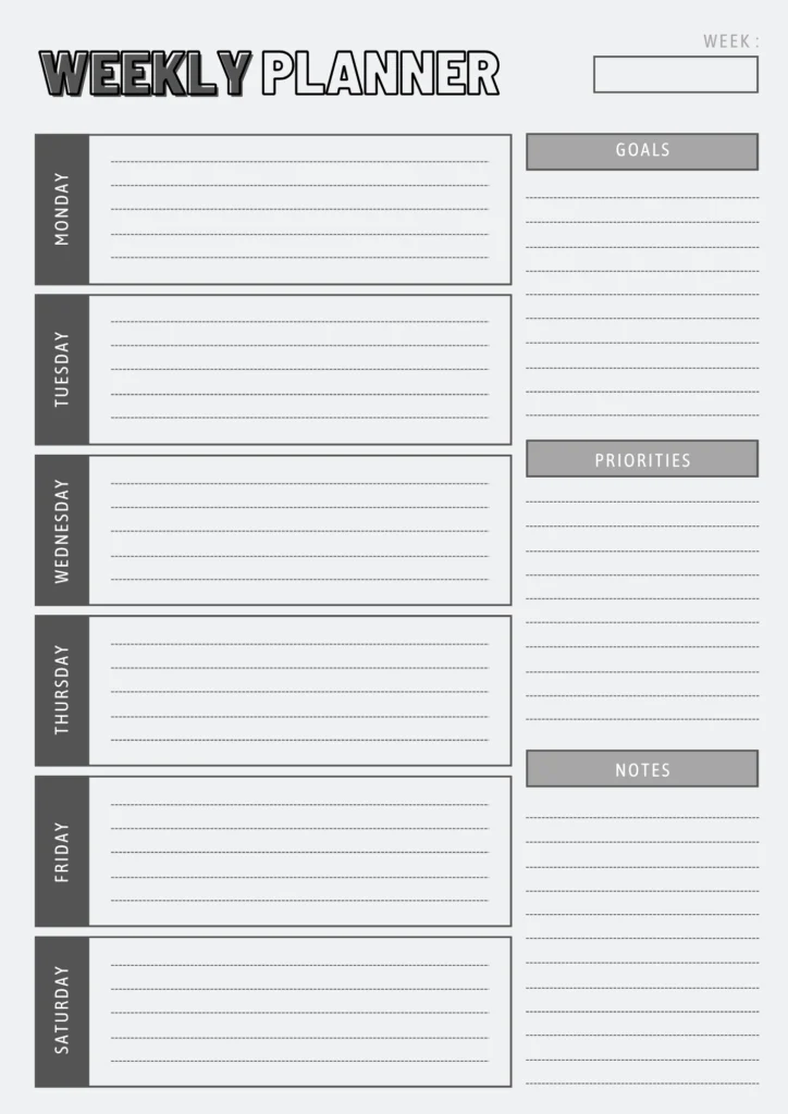 black and grey boxed weekly planner on a grey background
